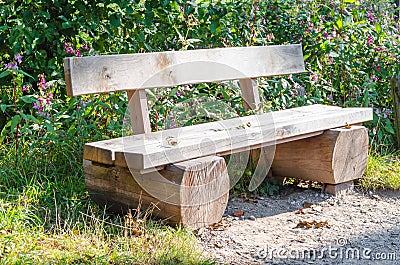 Bench, park bench made â€‹â€‹of tree trunk Stock Photo